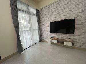 TV a/nebo společenská místnost v ubytování Suixiang B&B