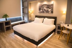 Posteľ alebo postele v izbe v ubytovaní Connect Studios & Apartments