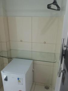 a small bathroom with a glass shower backdoor at Hotel Enlace in Ji-Paraná +99 photos
