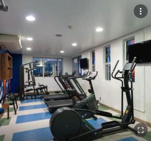 a gym with several treadmills and machines in a room at #SENSACIONAL# PREMIUM HOTEL Manaus AM in Manaus