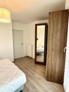 Posteľ alebo postele v izbe v ubytovaní T4 avec grande terrasse et parking privé