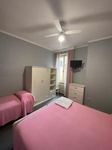 Postel nebo postele na pokoji v ubytování HOTEL LA LOGGIA