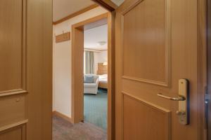 Voodi või voodid majutusasutuse Hotel Metropol & Spa Zermatt toas