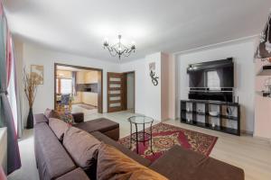Televízia a/alebo spoločenská miestnosť v ubytovaní Apartmanovy dům Bublajda