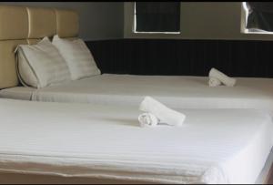 Postel nebo postele na pokoji v ubytování HAPPY HOTEL Tp Rạch Giá, Kiên Giang