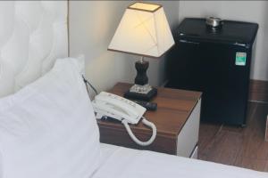 Postel nebo postele na pokoji v ubytování HAPPY HOTEL Tp Rạch Giá, Kiên Giang