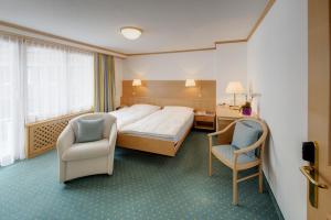 Voodi või voodid majutusasutuse Hotel Metropol & Spa Zermatt toas