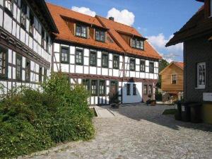 a large building with an orange roof at Hotel Goldener Hirsch in Suhl