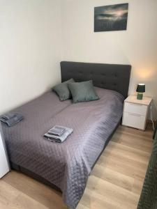 a bedroom with a bed with a tray on it at 3 rooms apartment in Center in Ålesund