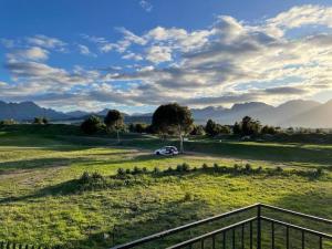 a car parked in the middle of a field at Mini Suits in Cape Town