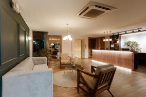 a living room with a couch and a table at 1616 Hotel in Medellín