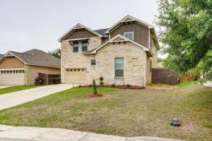a stone house with a driveway in front of it at San Antonio Vacation Rental with Patio Near SeaWorld in San Antonio