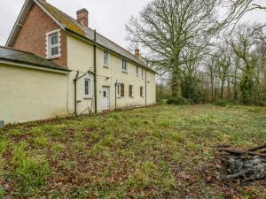 an old house with a grass yard in front of it at Heathfield in Taunton