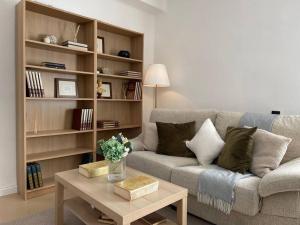 a living room with a couch and a coffee table at Penthouse in Vejer in Vejer de la Frontera