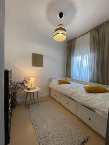 Postel nebo postele na pokoji v ubytování Penthouse in Vejer