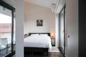 Postel nebo postele na pokoji v ubytování Designflats Gent
