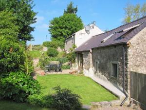 an internal view of a cottage with a garden at Last Barn in Saint Twynnells