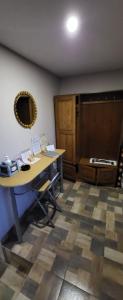an office with a desk and a mirror on the wall at Pri Đovetu in Ðurđevac