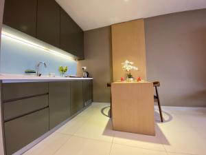 a kitchen with a sink and a counter at Amanjiwa 99R in Kampong Morten