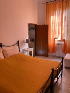 A bed or beds in a room at Il Giardino Nel Parco R&B