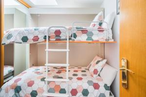 A bed or beds in a room at Dúplex Surf junto a la playa