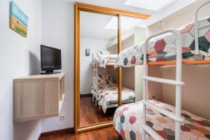 A bed or beds in a room at Dúplex Surf junto a la playa