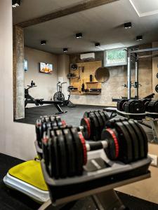 a gym with a bunch of gym equipment at Hotel Mediteran in Zadar