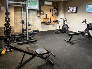 a gym with several exercise bikes in a room at Hotel Mediteran in Zadar