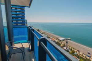 a view of the beach from the balcony of a building at ORBI CITY APART HOTEl in Batumi