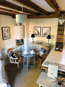 a kitchen with a table and chairs in a room at Self catering cottage in Market Bosworth in Market Bosworth
