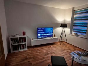 Et tv og/eller underholdning på Ferienwohnung Le Petit + 17 billeder