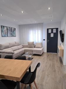 Televízia a/alebo spoločenská miestnosť v ubytovaní Casa de la Ilusión