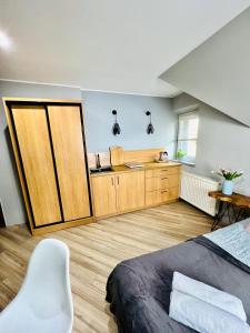 Kuchnia lub aneks kuchenny w obiekcie "Ku Słońcu" -Pokoje& Apartamenty - Jastrzębia Góra