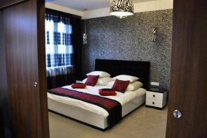 Łóżko lub łóżka w pokoju w obiekcie Hotel Europa