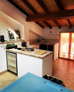 a kitchen with a counter and a stove top oven at Civico 18 B&B in Montecchio Emilia
