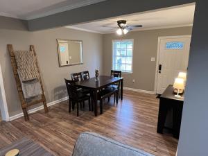 a dining room with a table and chairs at Spacious 3 bedroom home near Amphitheater/Baseball/shopping and much more in Pearl