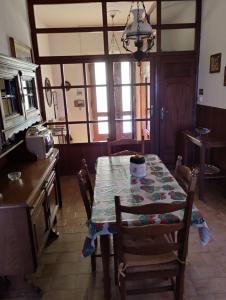 a kitchen with a table with a table cloth on it at Casa Graziella in Cecina