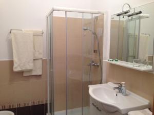 a bathroom with a shower and a sink at Apartment Duncovich in Cres