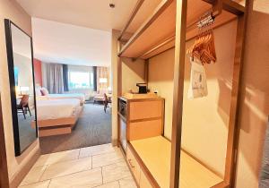 a hotel room with a bedroom and a bed at Lincoln Hotel Monterey Park Los Angeles in Monterey Park +199 photos