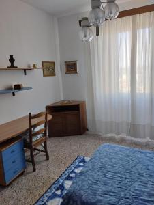 Łóżko lub łóżka w pokoju w obiekcie Casa Graziella