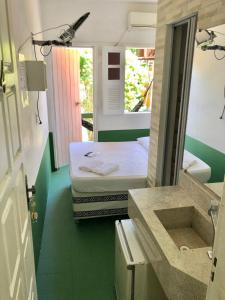 Ein Bett oder Betten in einem Zimmer der Unterkunft Tia Preta Pousada