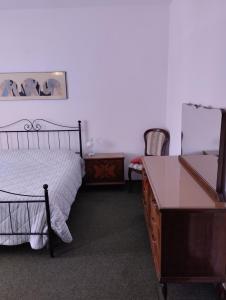 Łóżko lub łóżka w pokoju w obiekcie Casa Graziella
