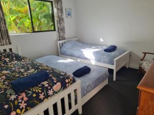Postel nebo postele na pokoji v ubytování Bookabarn + 3 fotografie