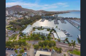an aerial view of a harbor with a marina at Magic On Melton in Townsville