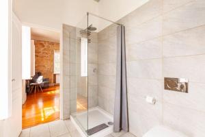 a shower with a glass door in a bathroom at Casa do Cabeço in Caramulo +63 photos