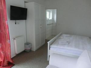 Postel nebo postele na pokoji v ubytování Landquartier