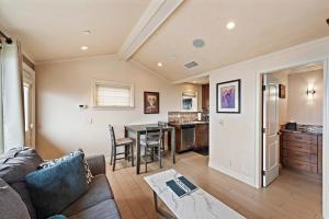 a living room with a couch and a table at Villa D'Arte at the Retreat in Laguna Beach in Laguna Beach