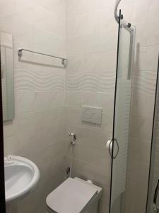 a bathroom with a toilet and a sink at Terminal guest house 24 in Rome