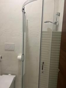 a bathroom with a glass shower with a toilet at Terminal guest house 24 in Rome