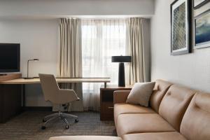 a living room with a couch and a desk at Residence Inn El Paso in El Paso